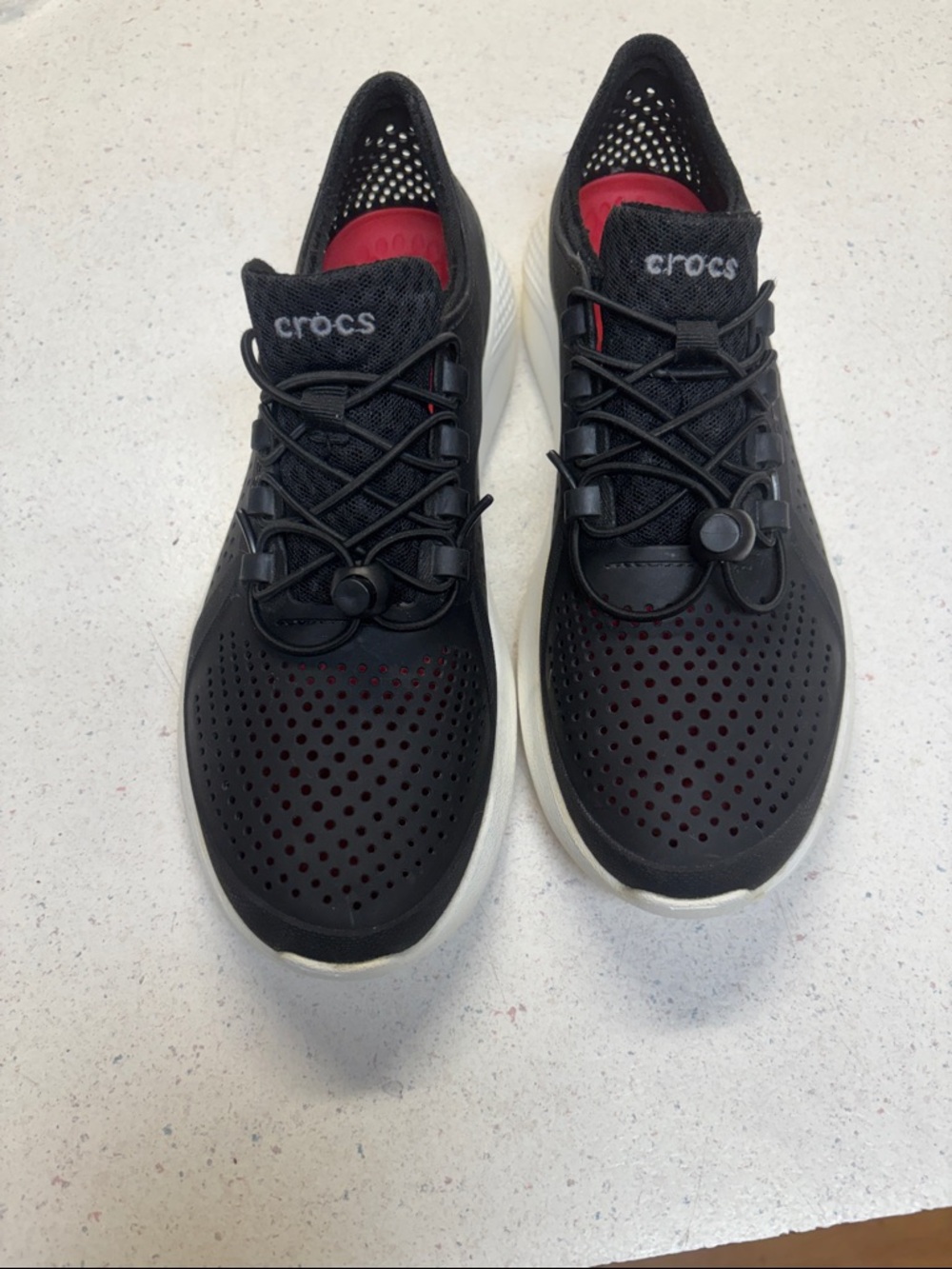 CROCS Black Slip-On Perforated Sneakers with White Soles and Red Insole